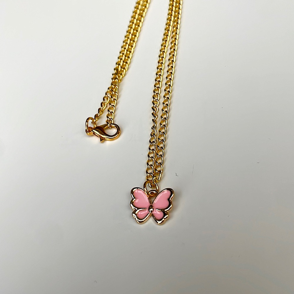 Pink butterfly charm necklace: gold color metal chain.